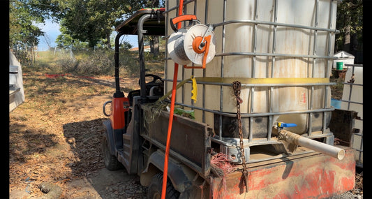 Algiere Ranch Kubota Water Truck carrying a food-grade IBC tote for cattle water delivery